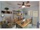 Home office space featuring a wooden desk, built in shelving and light blue accent wall at 23739 Forest View Dr, Land O Lakes, FL 34639