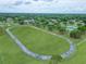 Aerial view of a community running track surrounded by lush greenery, offering a scenic location for fitness activities at 23739 Forest View Dr, Land O Lakes, FL 34639