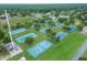 A collection of community tennis courts, framed by lush greenery, offer an invitation to outdoor recreation and enjoyment at 23739 Forest View Dr, Land O Lakes, FL 34639
