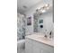 Bathroom featuring a white vanity, toilet and shower with curtain at 2413 Oxford Down Ct # 58, Sun City Center, FL 33573