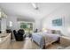 Bedroom with a large window and a cozy seating area at 2413 Oxford Down Ct # 58, Sun City Center, FL 33573
