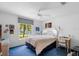 Bright bedroom with a ceiling fan, window, and natural light at 2413 Oxford Down Ct # 58, Sun City Center, FL 33573