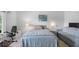 Cozy bedroom with natural light and workout equipment at 2413 Oxford Down Ct # 58, Sun City Center, FL 33573