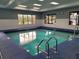 Relax in this well-lit indoor pool, perfect for swimming laps and aquatics, with multiple windows for natural light at 2413 Oxford Down Ct # 58, Sun City Center, FL 33573