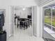 Bright kitchen featuring white cabinets, modern appliances, and breakfast bar for casual dining at 2413 Oxford Down Ct # 58, Sun City Center, FL 33573