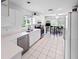 Well-lit kitchen with stainless steel appliances, white countertops, and a casual dining area at 2413 Oxford Down Ct # 58, Sun City Center, FL 33573