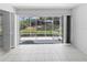 Enjoy outdoor living with a screened lanai, providing views of the lush landscaped backyard and gardens at 2413 Oxford Down Ct # 58, Sun City Center, FL 33573