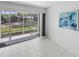 Screened-in patio offering seamless indoor-outdoor living with views of the well-maintained backyard at 2413 Oxford Down Ct # 58, Sun City Center, FL 33573