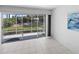 Relaxing screened patio with view to backyard, great for entertaining or enjoying the peaceful outdoor ambiance at 2413 Oxford Down Ct # 58, Sun City Center, FL 33573