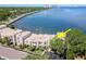 Aerial view of waterfront townhouse complex, showcasing lush landscaping and serene surroundings at 2807 W Hawthorne Rd # 11, Tampa, FL 33611