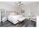 Relaxing bedroom with soft colors, a sitting area by the window, and gray vinyl flooring at 2807 W Hawthorne Rd # 11, Tampa, FL 33611