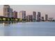 Stunning waterfront view of the city skyline with illuminated buildings at dusk at 2807 W Hawthorne Rd # 11, Tampa, FL 33611