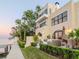 Stately home with a private dock, lush landscaping, and outdoor seating area at 2807 W Hawthorne Rd # 11, Tampa, FL 33611