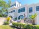 Elegant home exterior featuring large windows, a private patio, and well-manicured lawn at 2807 W Hawthorne Rd # 11, Tampa, FL 33611