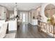Bright living area with white countertops, bar stools, hardwood flooring, and modern decor at 2807 W Hawthorne Rd # 11, Tampa, FL 33611