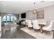 Bright living room with an open floor plan, hardwood floors, modern furniture, and an arched window view at 2807 W Hawthorne Rd # 11, Tampa, FL 33611