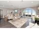 Stylish living room with hardwood floors, comfortable seating, and arched windows offering water views at 2807 W Hawthorne Rd # 11, Tampa, FL 33611