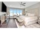 Beautiful main bedroom features a serene seating area, a luxurious bed, and large windows with waterfront views at 2807 W Hawthorne Rd # 11, Tampa, FL 33611