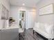 Bright home office with white desk and seating plus bonus reading nook and natural light at 2807 W Hawthorne Rd # 11, Tampa, FL 33611