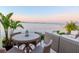 Cozy outdoor dining area offering stunning water views and city skyline in the background at 2807 W Hawthorne Rd # 11, Tampa, FL 33611