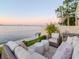 Relaxing patio space showcasing comfortable seating with scenic water views and city skyline at 2807 W Hawthorne Rd # 11, Tampa, FL 33611