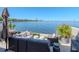 Relax on the waterfront patio with comfortable seating, lush greenery, and panoramic views of the water at 2807 W Hawthorne Rd # 11, Tampa, FL 33611
