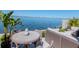Charming waterfront patio featuring a dining area and comfortable seating, perfect for enjoying the scenic views at 2807 W Hawthorne Rd # 11, Tampa, FL 33611