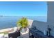 Enjoy serene waterfront views from this outdoor seating area, complete with stylish decor and a tranquil ambiance at 2807 W Hawthorne Rd # 11, Tampa, FL 33611