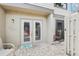 Private back patio with brick pavers, double doors and a separate exterior door at 330 Woods Landing Trail, Oldsmar, FL 34677
