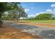 Golf course view with paved cart path and lush trees at 330 Woods Landing Trail, Oldsmar, FL 34677