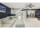 Open-concept living room with stairs, tiled flooring, and adjacent kitchen at 330 Woods Landing Trail, Oldsmar, FL 34677