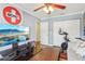 Cozy living room with television, ceiling fan, and an exercise bike at 330 Woods Landing Trail, Oldsmar, FL 34677