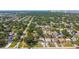 An aerial view highlights the location of a single-story home nestled in a well-established neighborhood near the city at 3315 W Pearl Ave, Tampa, FL 33611