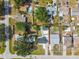 The aerial shot showcases the property lines of a single-story home with a shared driveway and well-maintained lawn at 3315 W Pearl Ave, Tampa, FL 33611