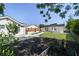 Wide-angle view of backyard, shed, and detached building at 3315 W Pearl Ave, Tampa, FL 33611