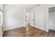 Bright bedroom with wood floors, a large window, and closet space at 3315 W Pearl Ave, Tampa, FL 33611