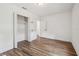 A view of the bedroom, including the closet and door to another room at 3315 W Pearl Ave, Tampa, FL 33611