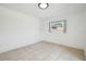 Bedroom with neutral colors and tile flooring at 3315 W Pearl Ave, Tampa, FL 33611