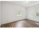 Bright bedroom with dark wood floors and a window at 3315 W Pearl Ave, Tampa, FL 33611