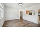 Inviting dining room with hardwood floors, connecting seamlessly to the kitchen area for easy entertaining at 3315 W Pearl Ave, Tampa, FL 33611