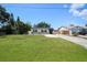 Home with spacious front lawn, driveway, and well-maintained landscaping at 3315 W Pearl Ave, Tampa, FL 33611