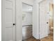Hallway perspective showcasing a view into a bright bedroom and a neatly tiled bathroom at 3315 W Pearl Ave, Tampa, FL 33611