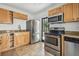 Kitchen featuring stainless steel appliances, cabinets, and sink at 3315 W Pearl Ave, Tampa, FL 33611