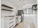 The kitchen has stainless steel appliances and shelving at 3315 W Pearl Ave, Tampa, FL 33611