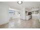 View of the living room and kitchen with tiled flooring at 3315 W Pearl Ave, Tampa, FL 33611