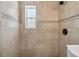 Nicely tiled shower stall with window and updated fixture at 3315 W Pearl Ave, Tampa, FL 33611