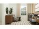 Stylishly staged Bedroom features a crib, comfortable rocking chair, and ample natural light at 3469 Lapis Lake Dr, Zephyrhills, FL 33541