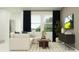 Inviting living room with comfortable seating, modern decor, and large windows with backyard views at 3469 Lapis Lake Dr, Zephyrhills, FL 33541