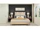 Serene bedroom with a stylish bed, bedside tables, and artwork, creating a relaxing atmosphere at 3469 Lapis Lake Dr, Zephyrhills, FL 33541