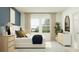 Bright bedroom with an accent wall, plush bed, and ample natural light at 3477 Lapis Lake Dr, Zephyrhills, FL 33541